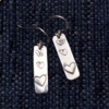 silver dangly earrings with stamped hearts