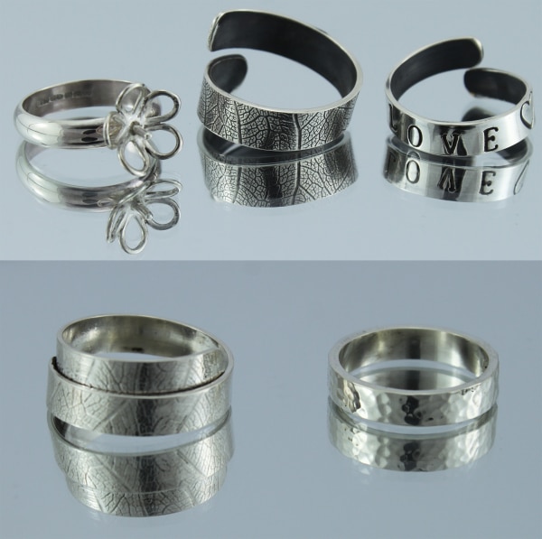 Silver rings on reflective surface