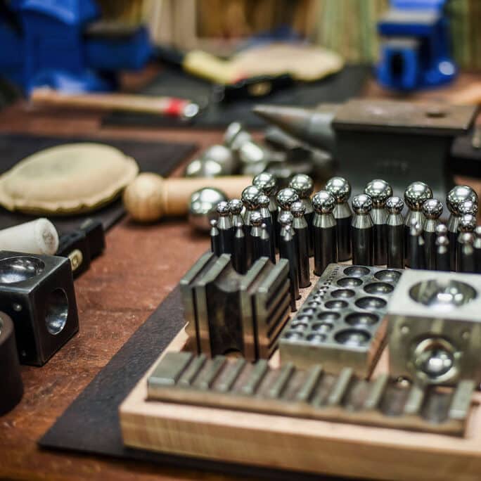 Hammers and doming punches and blocks on the workbench