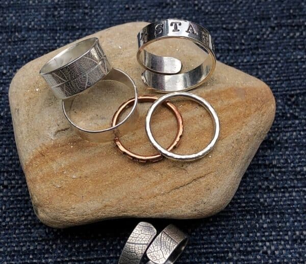 Happy people with wedding rings