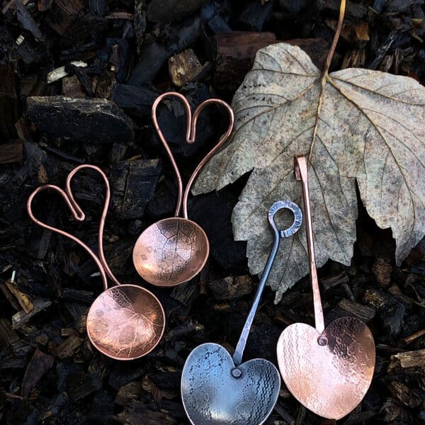 Copper and oxidised copper spoons