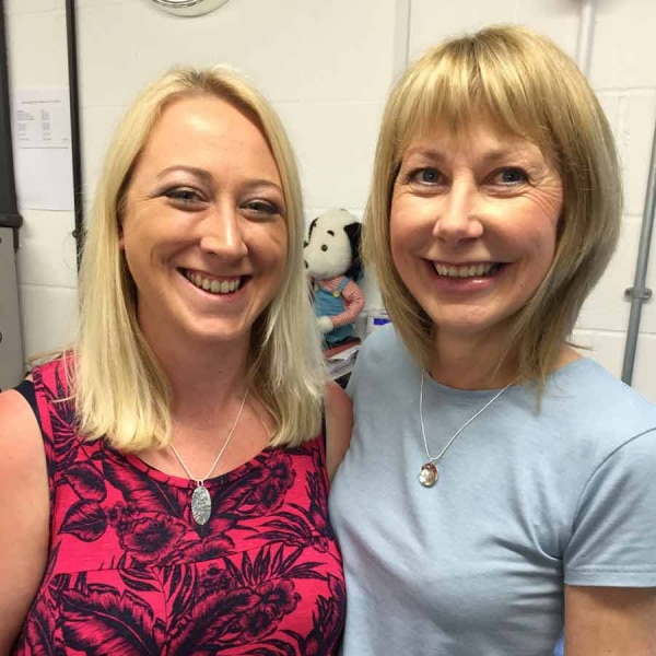 Mum and Daughter smiling in the workshop