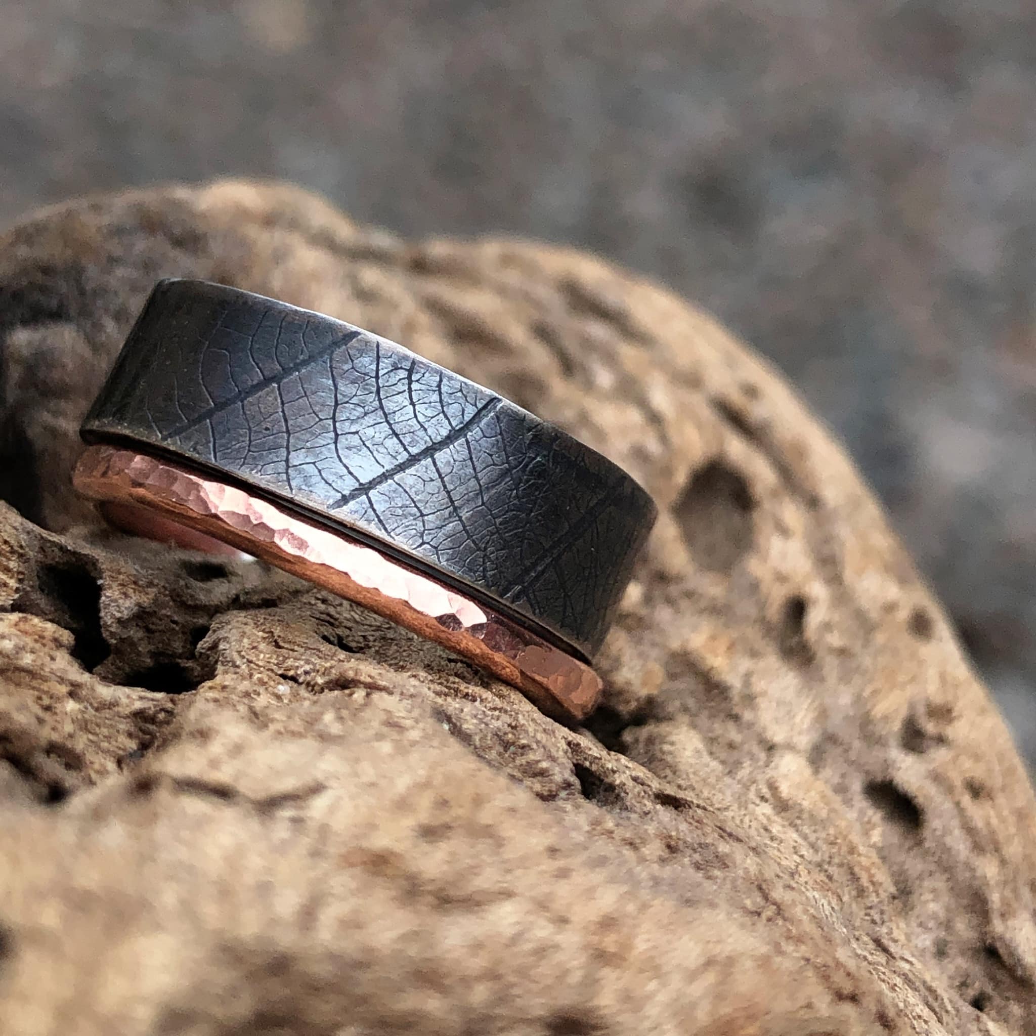 Oxidised silver ring with leaf print and hammered copper ring