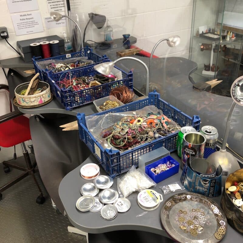 Jewellery benches with boxes of junk and broken jewellery