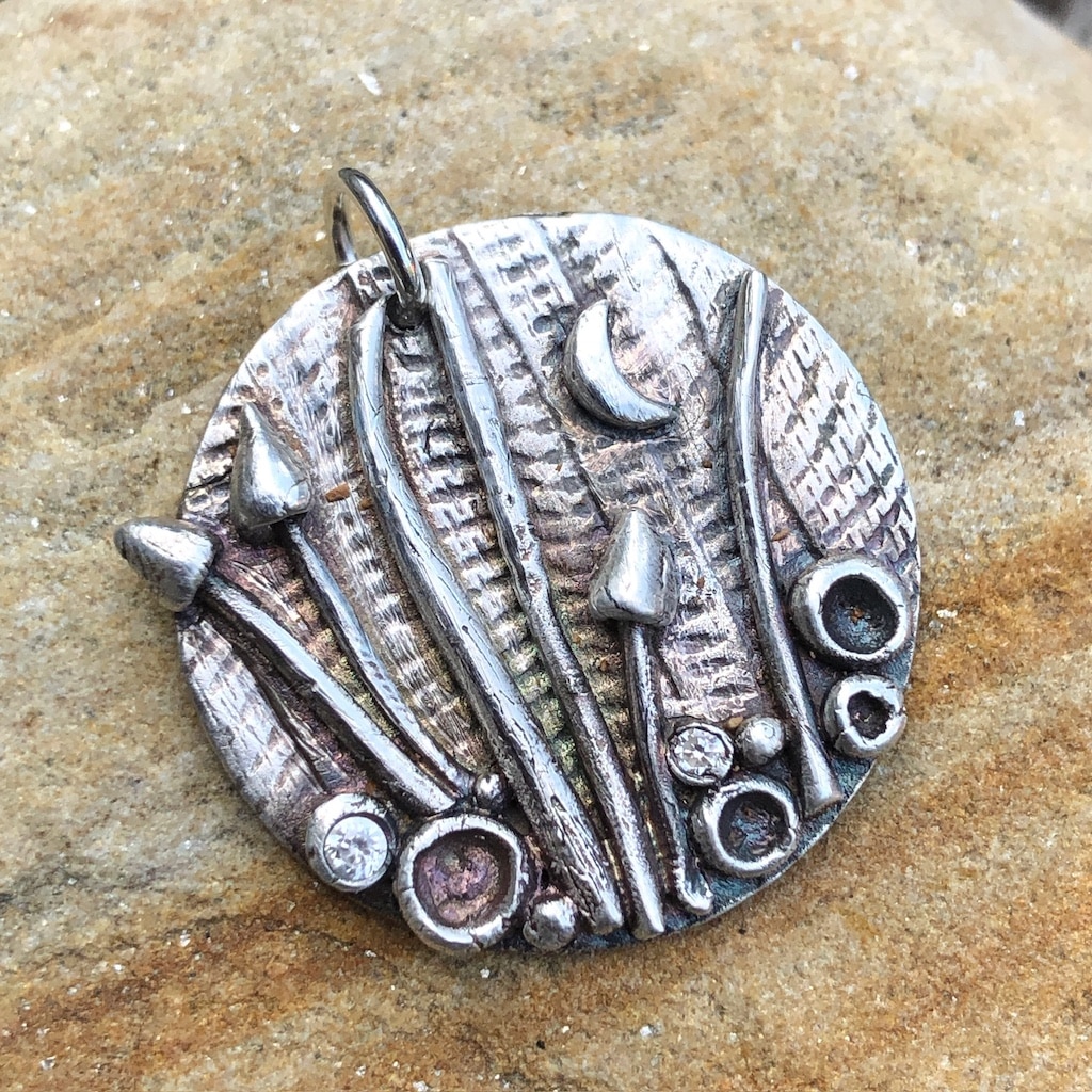 Silver clay pendant with toadstools