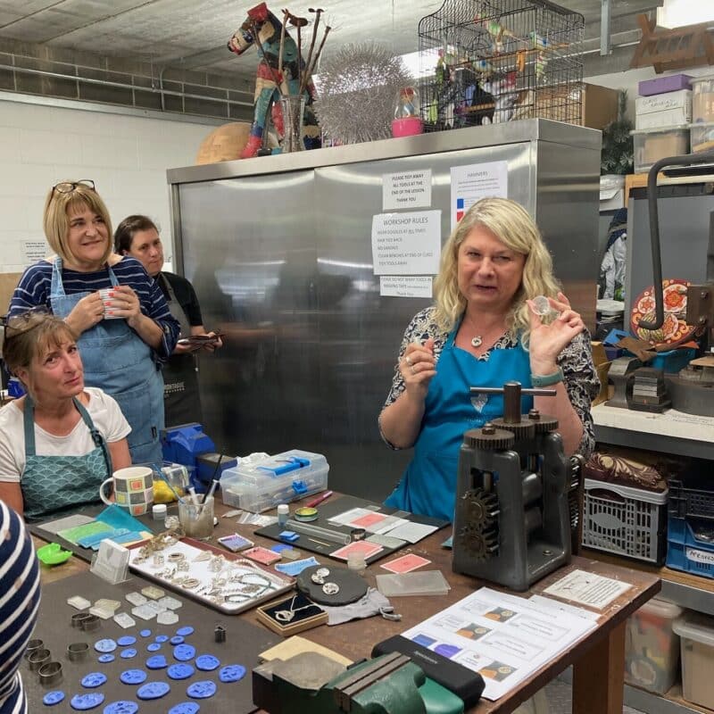 Students watching a silver clay demonstration from the tutor in the workshop