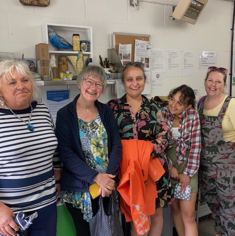 Happy group together in the workshop