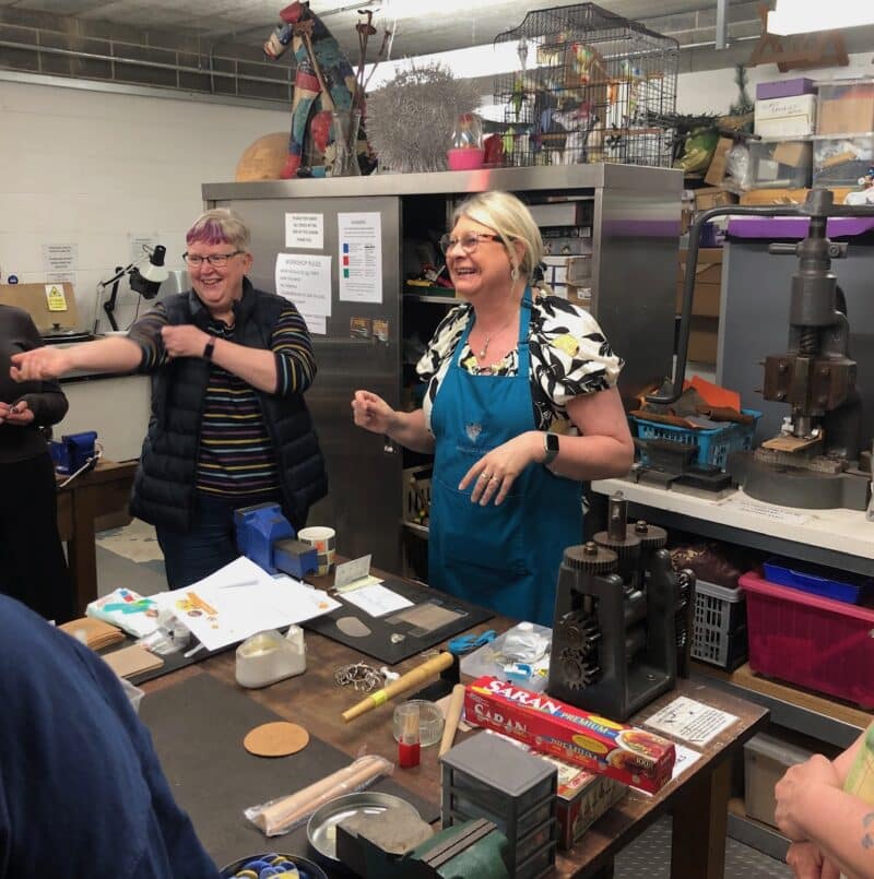Tutor demonstrating silver clay ring techniques in the workshop
