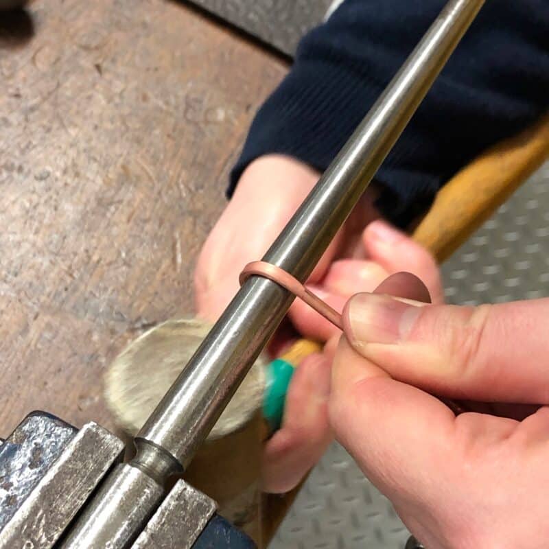 Forming copper wire around a mandrel in the workshop
