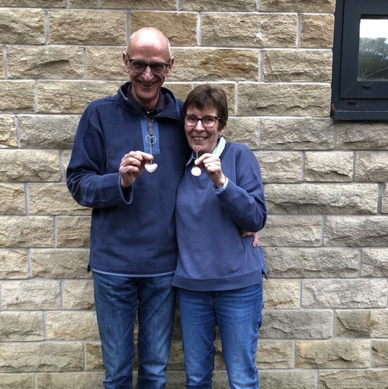 Happy couple with their love spoons