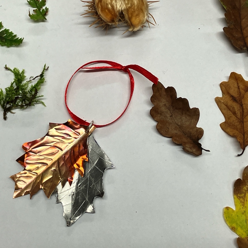 Mixed metal decoration with collected leaves