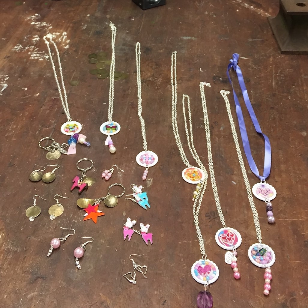 colourful jewellery on wooden bench