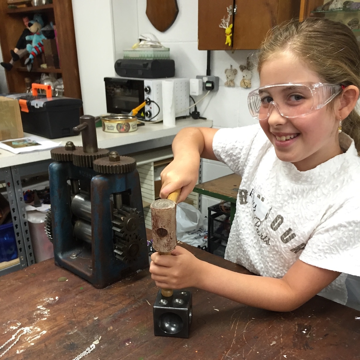 Young student using tools in the workshop