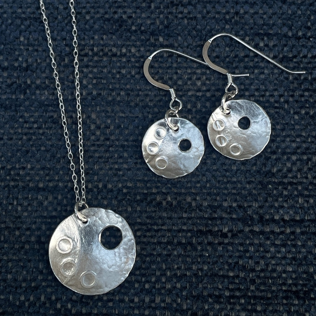 Silver pendant and earrings. Circles with cutout and stamped circles.