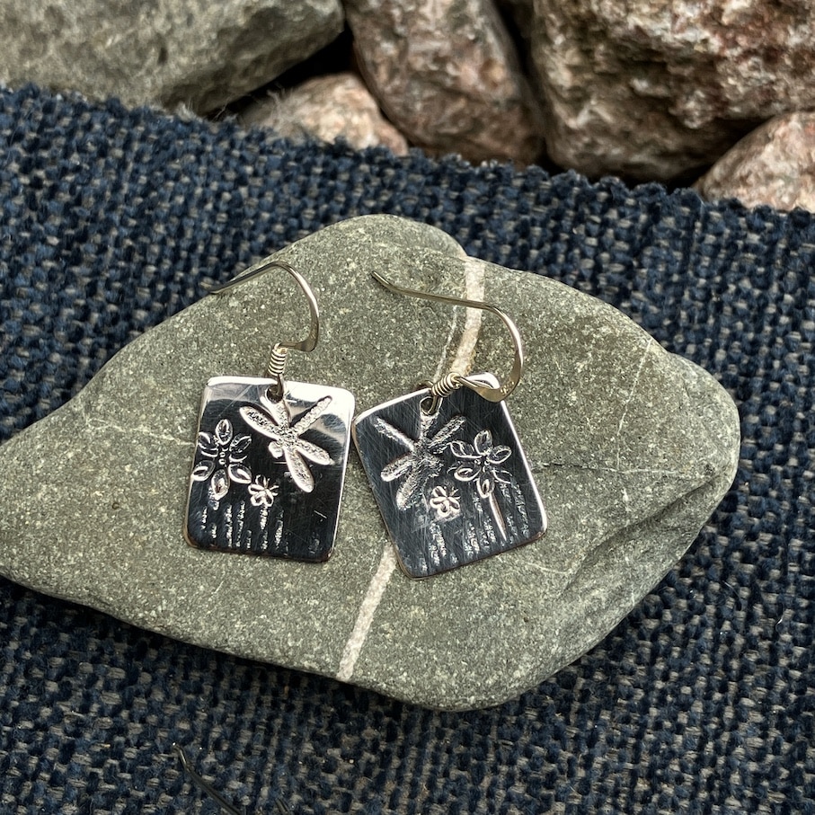 Silver earrings with dragonfly and flower detail